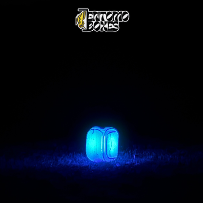 EntomoBoxes UV LED moth trap glowing blue at night attracting moths to the mesh