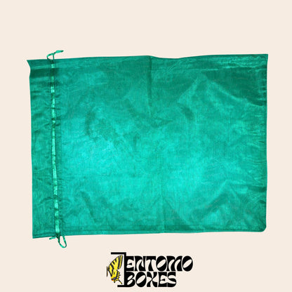 Green fine mesh insect breeding bag with drawstring closure, laid flat on a beige background.